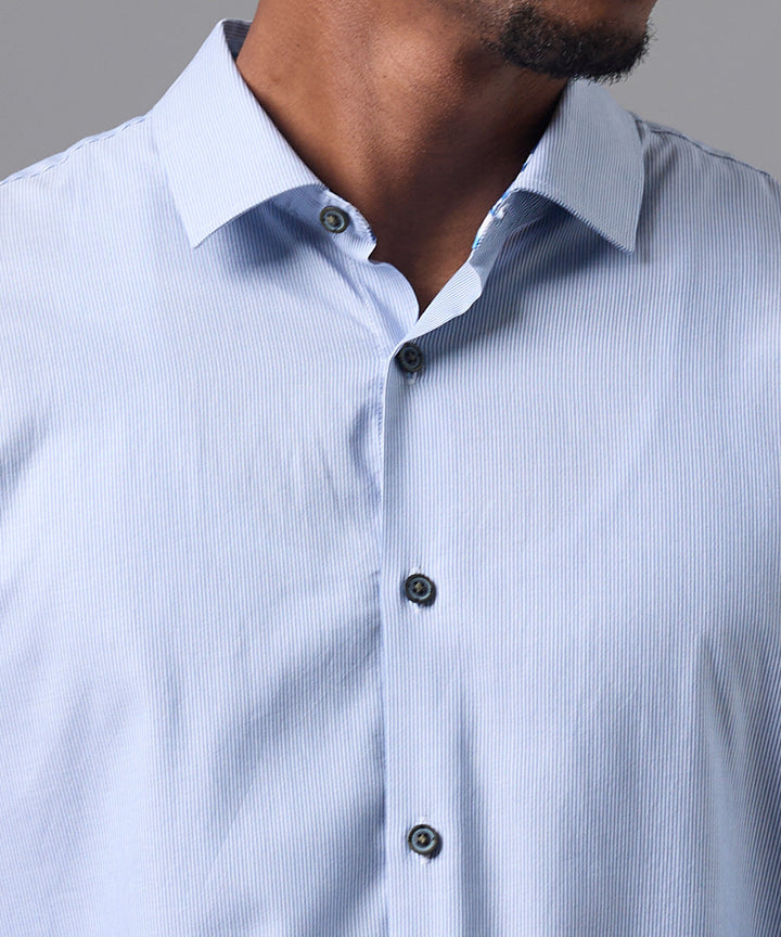 CAMISA MANGA LARGA OXFORD CUELLO SPREAD CLASSIC FIT AZUL A RAYAS OI25