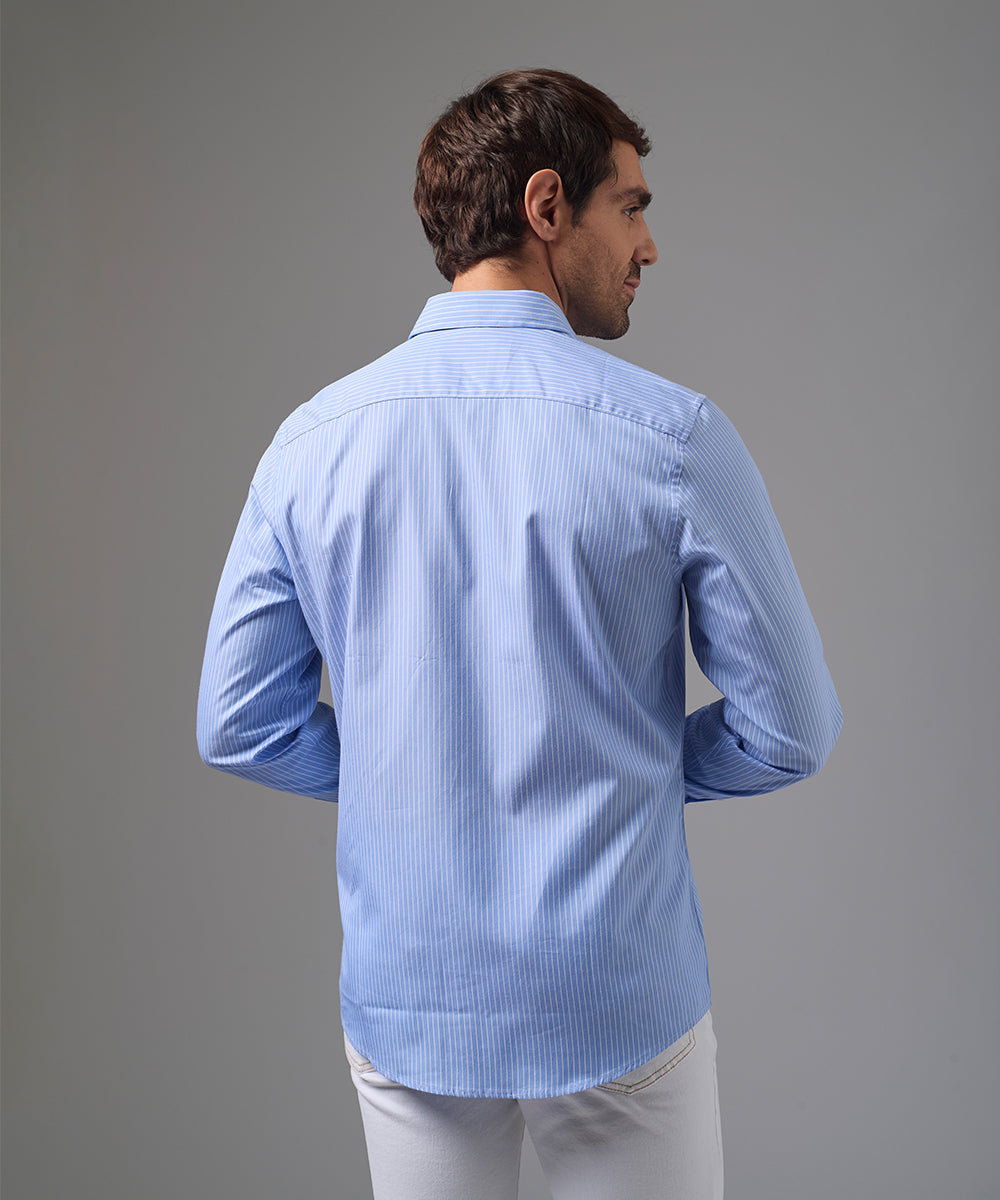 CAMISA MANGA LARGA PECHERA OJAL CLASSIC FIT CELESTE C/RAYAS PV26