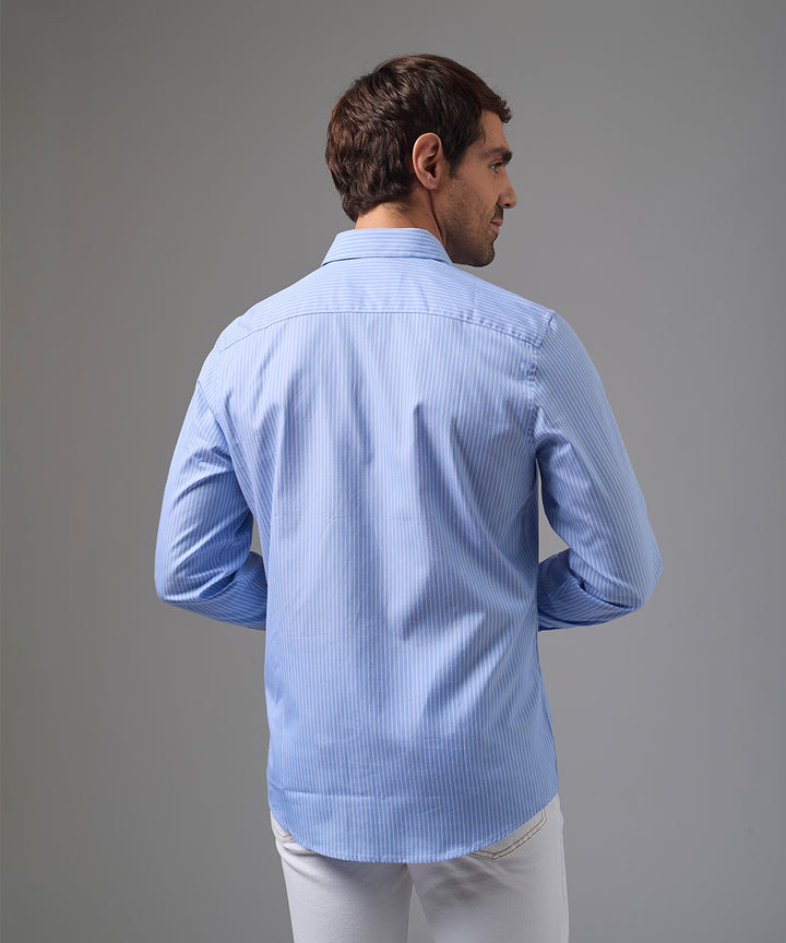 CAMISA MANGA LARGA PECHERA OJAL CLASSIC FIT CELESTE C/RAYAS PV26