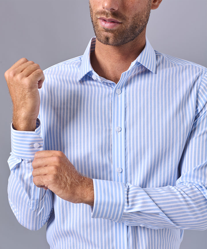 CAMISA MANGA LARGA DE VESTIR C. SPREAD CELESTE C/RAYAS OI24