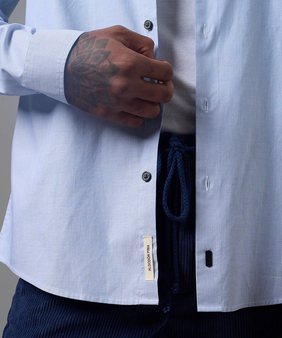 CAMISA MANGA LARGA OXFORD CUELLO SPREAD CLASSIC FIT AZUL A RAYAS OI25