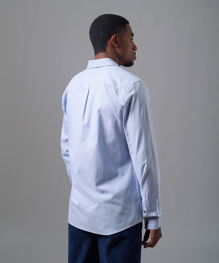 CAMISA MANGA LARGA OXFORD CUELLO SPREAD CLASSIC FIT AZUL A RAYAS OI25