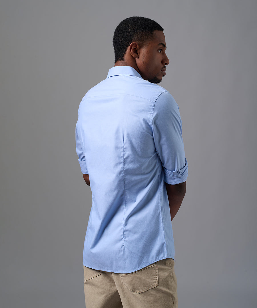 CAMISA MANGA LARGA PECHERA OJAL SLIM FIT CELESTE OI25