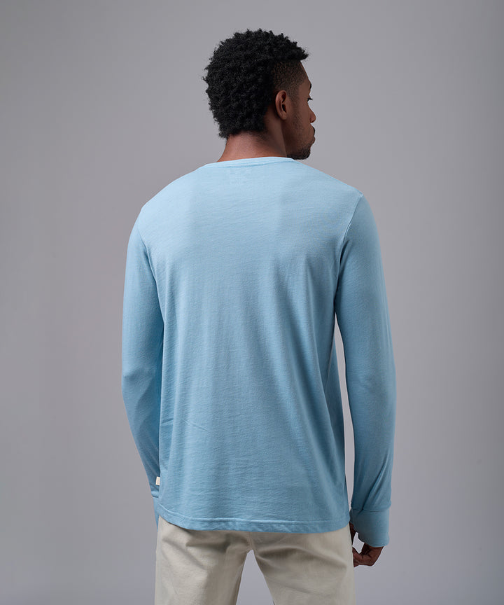 POLO MANGA LARGA JERSEY OJAL EN PUÑO CELESTE OI25