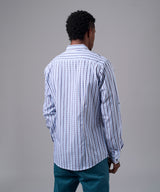 CAMISA MANGA LARGA CUELLO CORTO REDONDEADO SLIM FIT CELESTE C/RAYAS OI25