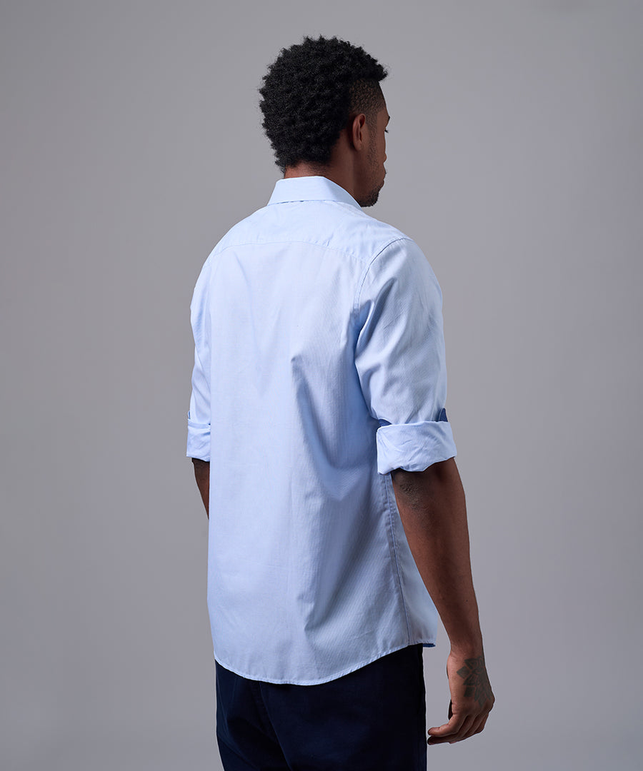 CAMISA MANGA LARGA PECHERA OJAL CLASSIC FIT CELESTE OI25