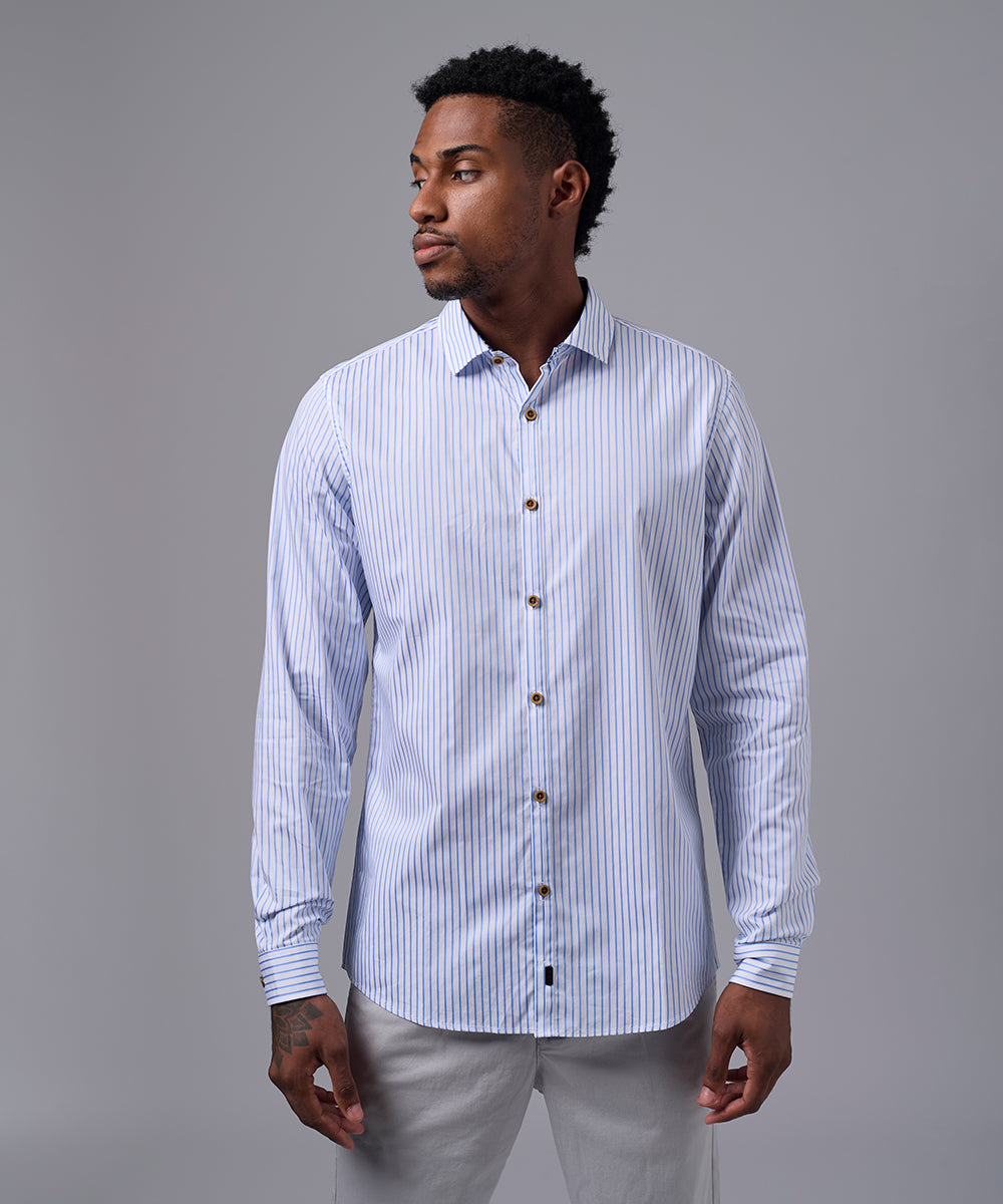 CAMISA MANGA LARGA PECHERA OJAL SLIM FIT CELESTE C/RAYAS OI25