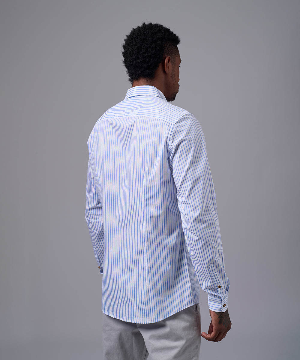 CAMISA MANGA LARGA PECHERA OJAL SLIM FIT CELESTE C/RAYAS OI25