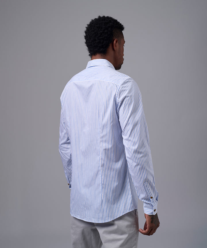 CAMISA MANGA LARGA PECHERA OJAL SLIM FIT CELESTE C/RAYAS OI25